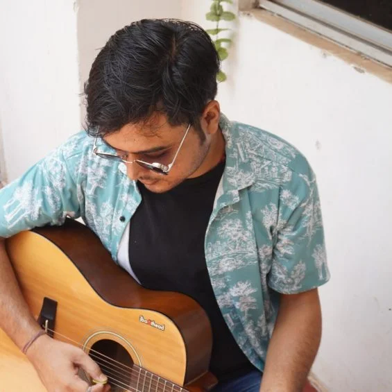 Teacher playing guitar